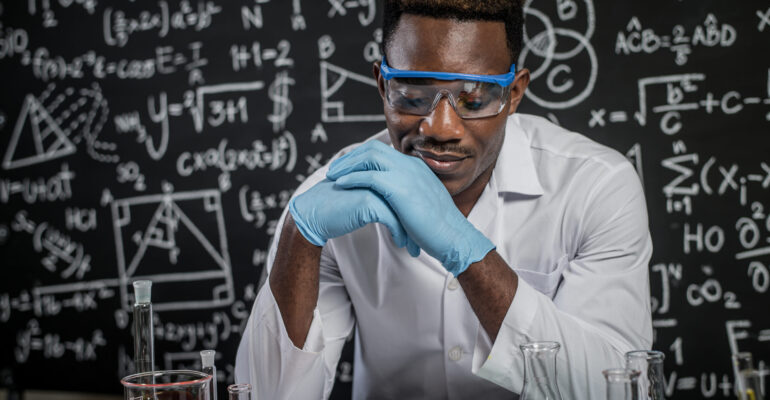 Scientists use ideas and look at chemicals in the laboratory.